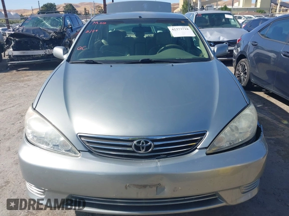 2005 Toyota Camry LE z VIN 4T1BE30K65U592500, wystawiony jako IAAI lot #42373718 z przebiegiem 189 054 mil mil oraz . Historia ofert i sprzedaży dostępna na DreamBid. Obrazek 12.