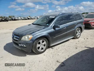 2011 Mercedes-Benz GL-Class GL 450 with VIN 4JGBF7BE2BA654807, listed as a Copart auction lot 77133244 with 133,748 mi miles and Salvage Title. Bid and sale history available at carsss.com. Image 1.
