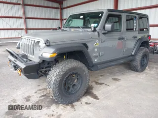 2021 Jeep Wrangler Unlimited Sport S z VIN 1C4HJXDG2MW542087, wystawiony jako IAAI lot #41893734 z przebiegiem 57 000 mil mil oraz . Historia ofert i sprzedaży dostępna na DreamBid. Obrazek 2.