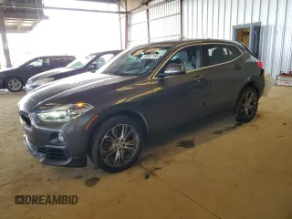2018 BMW X2 sDrive28i with VIN WBXYJ3C34JEJ81456, listed as a Copart auction lot 50997785 with 54,057 mi miles and Salvage Title. Bid and sale history available at carsss.com. Image 1.