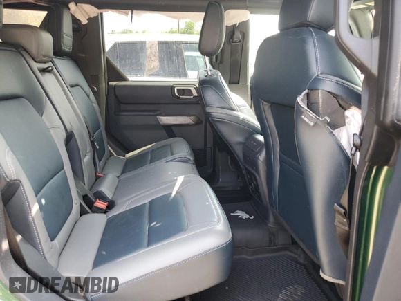 2023 Ford Bronco z VIN 1FMEE5DP7PLB60568, wystawiony jako Copart lot #62118915 z przebiegiem 25 681 mil mil oraz Nie do naprawy • Non repairable. Historia ofert i sprzedaży dostępna na DreamBid. Obrazek 11.