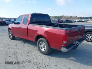 2000 Ford F-150 XL with VIN 1FTZX1729YNC32076, listed as a IAAI auction lot 41523364 with 216,726 mi miles. Bid and sale history available at carsss.com. Image 3.
