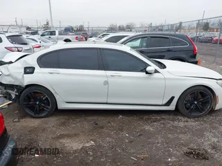 2016 BMW 7 Series 740i with VIN WBA7E2C50GG714647, listed as a IAAI auction lot 41745442 with 134,399 mi miles and . Bid and sale history available at carsss.com. Image 14.