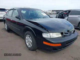 1999 Nissan Maxima GXE z VIN JN1CA21DXXT814014, wystawiony jako IAAI lot #41720870 z przebiegiem 198 926 mil mil oraz . Historia ofert i sprzedaży dostępna na DreamBid. Obrazek 1.
