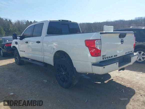 2018 Nissan Titan XD SV with VIN 1N6BA1F40JN523851, listed as a IAAI auction lot 41800730 with 104,527 mi miles. Bid and sale history available at carsss.com. Image 3.