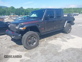2021 Jeep Gladiator Rubicon z VIN 1C6JJTBG9ML592538, wystawiony jako IAAI lot #42206035 z przebiegiem 37 945 mil mil oraz . Historia ofert i sprzedaży dostępna na DreamBid. Obrazek 2.
