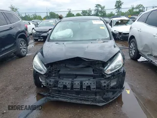 2017 Ford Focus SE z VIN 1FADP3F25HL253466, wystawiony jako IAAI lot #42303404 z przebiegiem 89 779 mil mil oraz . Historia ofert i sprzedaży dostępna na DreamBid. Obrazek 13.