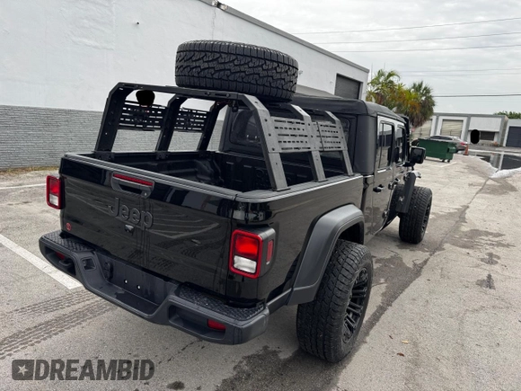 2024 Jeep Gladiator Sport S with VIN 1C6HJTAG2RL132886, listed as a Copart auction lot 63946735 with 6,111 mi miles and Clean title. Bid and sale history available at DreamBid. Image 4.