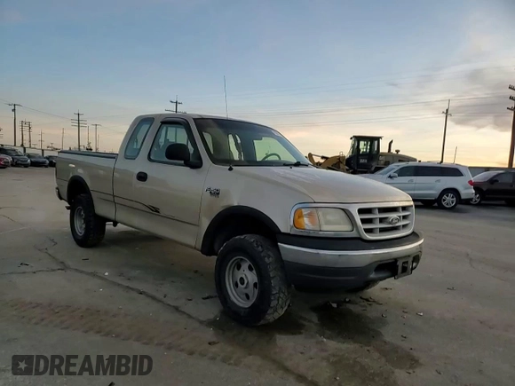 1999 Ford F-150 z VIN 2FTRX18W3XCA06671, wystawiony jako Copart lot #85561784 z przebiegiem 100 579 mil mil oraz Szkoda całkowita • Salvage title. Historia ofert i sprzedaży dostępna na DreamBid. Obrazek 11.