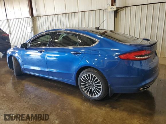 2017 Ford Fusion Titanium z VIN 3FA6P0D99HR162354, wystawiony jako Copart lot #61753395 z przebiegiem 100 678 mil mil oraz Szkoda całkowita • Salvage title. Historia ofert i sprzedaży dostępna na DreamBid. Obrazek 2.
