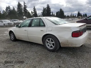 2000 Cadillac Seville Touring STS z VIN 1G6KY5497YU191639, wystawiony jako Copart lot #49658115 z przebiegiem 82 725 mil mil oraz Szkoda całkowita • Salvage title. Historia ofert i sprzedaży dostępna na DreamBid. Obrazek 2.