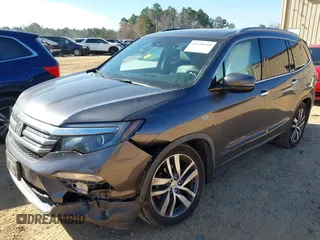 2017 Honda Pilot Touring with VIN 5FNYF5H92HB038893, listed as a IAAI auction lot 41639555 with 100,354 mi miles. Bid and sale history available at carsss.com. Image 2.