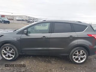 2015 Ford Escape Titanium with VIN 1FMCU9J94FUB49236, listed as a IAAI auction lot 42117378 with 112,267 mi miles. Bid and sale history available at carsss.com. Image 15.