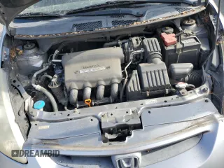 2007 Honda Fit z VIN JHMGD38447S026125, wystawiony jako Copart lot #56554145 z przebiegiem 227 284 mil mil oraz Szkoda całkowita • Salvage title. Historia ofert i sprzedaży dostępna na DreamBid. Obrazek 11.
