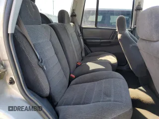 1997 Jeep Grand Cherokee Laredo with VIN 1J4GZ58S5VC561060, listed as a Copart auction lot 52098315 with 267,245 mi miles and Salvage title. Bid and sale history available at DreamBid. Image 11.