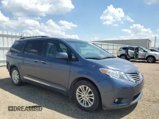 2015 Toyota Sienna XLE with VIN 5TDYK3DC4FS619385, listed as a Copart auction lot 57090385 with 112,896 mi miles and Salvage title. Bid and sale history available at DreamBid. Image 4.