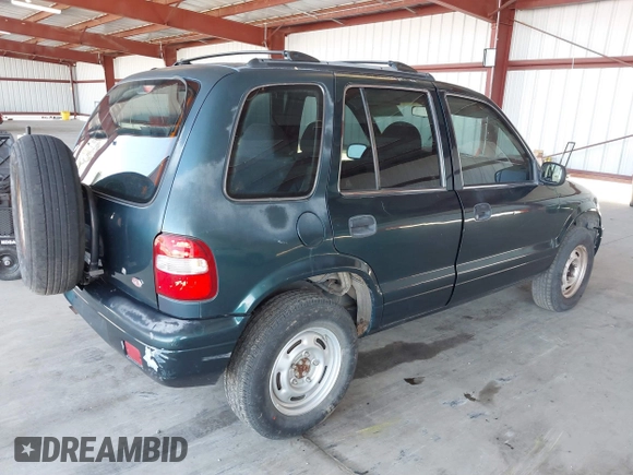 2000 Kia Sportage with VIN KNDJB7232Y5651398, listed as a IAAI auction lot 41678617 with 156,144 mi miles. Bid and sale history available at carsss.com. Image 4.
