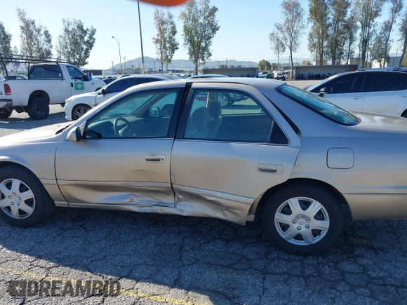 2001 Toyota Camry CE with VIN JT2BG22KX10559757, listed as a IAAI auction lot 41823719 with 72,775 mi miles. Bid and sale history available at carsss.com. Image 6.