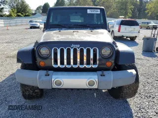 2008 Jeep Wrangler Unlimited Sahara with VIN 1J4GB59138L506461, listed as a Copart auction lot 75082664 with 178,944 mi miles and Salvage title. Bid and sale history available at DreamBid. Image 5.