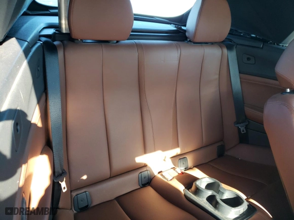 2015 BMW 2 Series 228i xDrive with VIN WBA1K7C57FV235082, listed as a Copart auction lot 87412554 with 75,061 mi miles and Salvage Title. Bid and sale history available at carsss.com. Image 10.