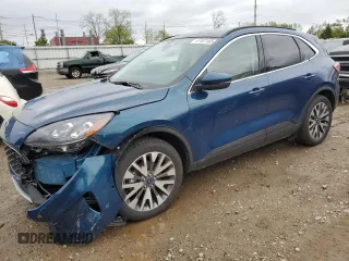 2020 Ford Escape Titanium z VIN 1FMCU9J99LUA40296, wystawiony jako Copart lot #57107165 z przebiegiem 39 625 mil mil oraz Tytuł czysty. Historia ofert i sprzedaży dostępna na DreamBid. Obrazek 1.