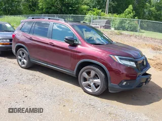 2019 Honda Passport Touring with VIN 5FNYF8H9XKB027990, listed as a IAAI auction lot 42343990 with 47,477 mi miles and . Bid and sale history available at DreamBid. Image 1.