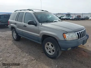 1999 Jeep Grand Cherokee Laredo with VIN 1J4GW58S6XC613307, listed as a IAAI auction lot 41592687 with 264,176 mi miles. Bid and sale history available at carsss.com. Image 1.