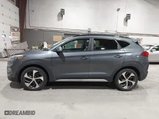 2018 Hyundai Tucson Value with VIN KM8J3CA22JU688957, listed as a IAAI auction lot 41868195 with 117,256 mi miles. Bid and sale history available at carsss.com. Image 14.