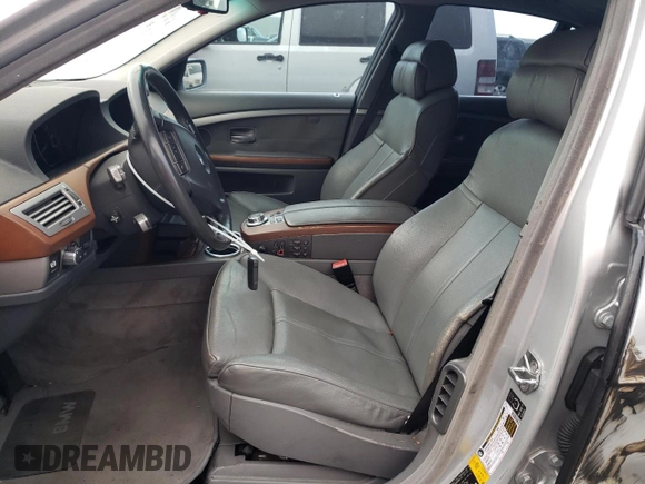 2006 BMW 7 Series 750i with VIN WBAHL83586DT05258, listed as a Copart auction lot 77033744 with 129,376 mi miles and Salvage Title. Bid and sale history available at DreamBid. Image 7.