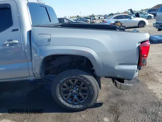 2021 Toyota Tacoma SR5 with VIN 5TFAZ5CN7MX101810, listed as a IAAI auction lot 42454418 with 58,930 mi miles and . Bid and sale history available at DreamBid. Image 18.