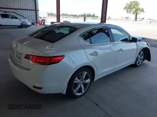2014 Acura ILX Technology with VIN 19VDE1F73EE005200, listed as a IAAI auction lot 41854914 with 106,929 mi miles and . Bid and sale history available at DreamBid. Image 4.