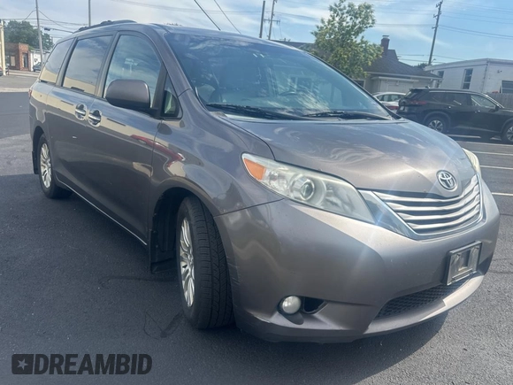 2015 Toyota Sienna XLE with VIN 5TDYK3DC5FS567460, listed as a Copart auction lot 63311295 with 296,433 mi miles and Clean title. Bid and sale history available at DreamBid. Image 1.