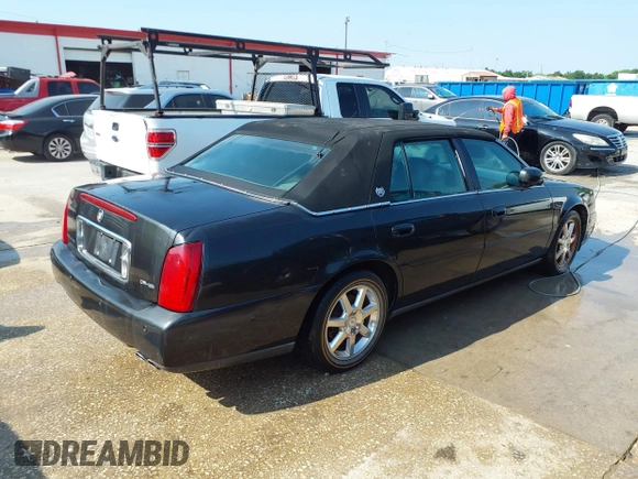 2001 Cadillac DeVille DHS z VIN 1G6KE57YX1U190955, wystawiony jako IAAI lot #41941668 z przebiegiem 191 040 mil mil oraz . Historia ofert i sprzedaży dostępna na DreamBid. Obrazek 4.