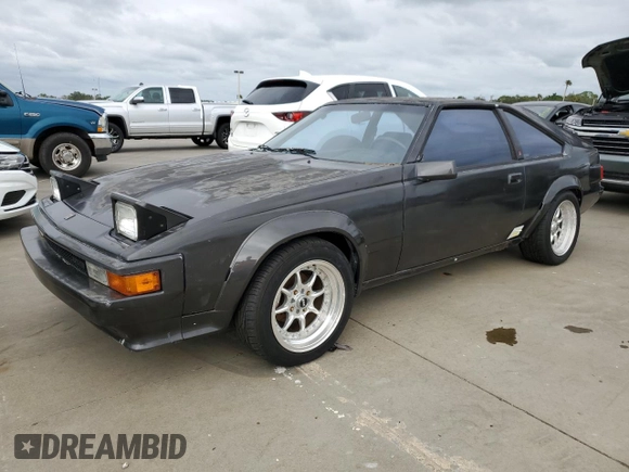 1985 Toyota Supra с VIN JT2MA67L3F0151708, выставлен на аукционе Copart как лот 74672844 с пробегом 60 346 миль миль и Списание • Salvage title. История ставок и продаж доступна на DreamBid. Изображение 1.