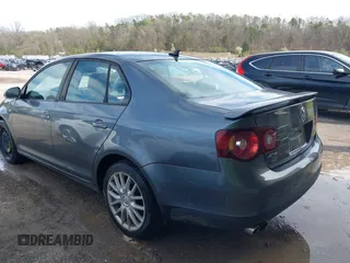 2009 Volkswagen Jetta Wolfsburg Edition with VIN 3VWRJ71K99M023071, listed as a IAAI auction lot 41853293 with 121,311 mi miles and . Bid and sale history available at DreamBid. Image 3.