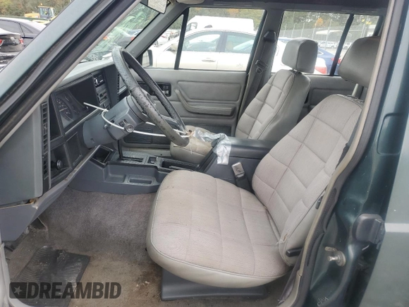 1993 Jeep Cherokee Sport with VIN 1J4FT68S4PL588241, listed as a Copart auction lot 80115884 with 204,174 mi miles and Salvage Title. Bid and sale history available at carsss.com. Image 7.