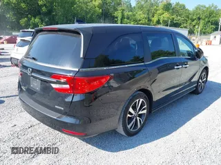 2021 Honda Odyssey Touring with VIN 5FNRL6H84MB027396, listed as a IAAI auction lot 42616650 with 67,207 mi miles and . Bid and sale history available at DreamBid. Image 4.