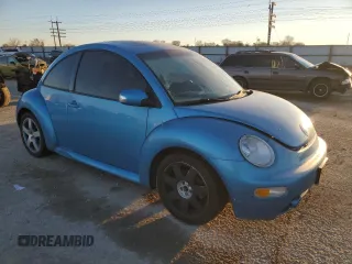 2004 Volkswagen New Beetle Coupe Satellite Blue with VIN 3VWGK31CX4M419900, listed as a Copart auction lot 41627155 with 129,510 mi miles and Salvage Title. Bid and sale history available at carsss.com. Image 4.