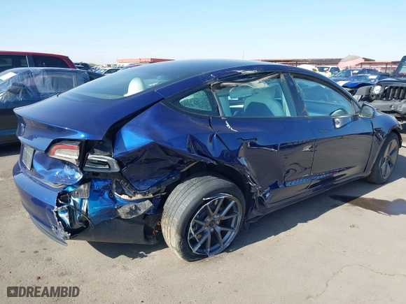 2023 Tesla Model 3 with VIN 5YJ3E1EA9PF697573, listed as a IAAI auction lot 41173833 with 6,966 mi miles. Bid and sale history available at carsss.com. Image 4.
