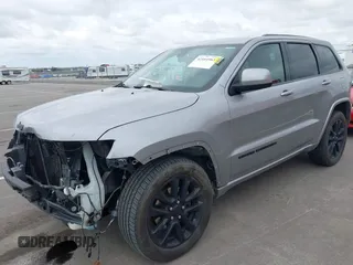2017 Jeep Grand Cherokee Laredo with VIN 1C4RJFAG1HC701921, listed as a IAAI auction lot 42164963 with 135,039 mi miles and . Bid and sale history available at DreamBid. Image 2.
