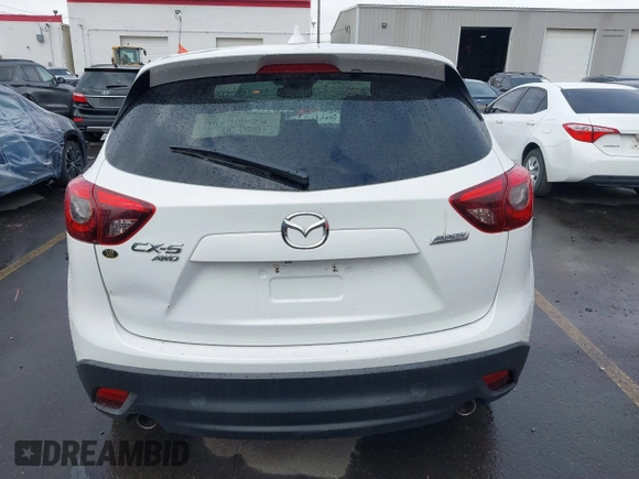 2016 Mazda CX-5 Grand Touring with VIN JM3KE4DY0G0705691, listed as a IAAI auction lot 40880798 with 130,624 mi miles. Bid and sale history available at carsss.com. Image 16.