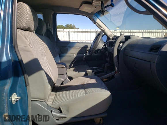 2003 Nissan Frontier XE with VIN 1N6ED26Y93C468148, listed as a Copart auction lot 76468404 with 178,257 mi miles and Salvage title. Bid and sale history available at DreamBid. Image 7.
