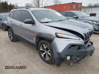 2016 Jeep Cherokee Trailhawk z VIN 1C4PJMBS7GW192574, wystawiony jako IAAI lot #41986638 z przebiegiem 144 970 mil mil oraz . Historia ofert i sprzedaży dostępna na DreamBid. Obrazek 1.