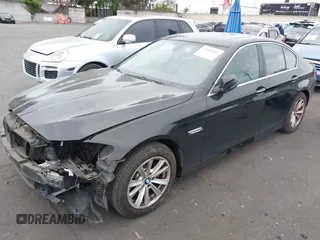 2015 BMW 5 Series 528i with VIN WBA5A5C56FD514814, listed as a IAAI auction lot 42052381 with 76,306 mi miles. Bid and sale history available at carsss.com. Image 2.