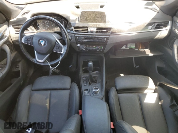 2018 BMW X1 xDrive28i with VIN WBXHT3C38J5K28174, listed as a Copart auction lot 57333385 with 50,064 mi miles and Salvage title. Bid and sale history available at DreamBid. Image 8.