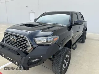 2023 Toyota Tacoma 4WD SR with VIN 3TYCZ5AN0PT110522, listed as a IAAI auction lot 41928557 with 45,116 mi miles. Bid and sale history available at carsss.com. Image 1.