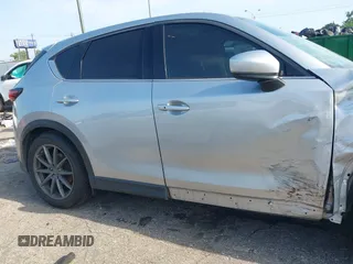 2020 Mazda CX-5 Grand Touring with VIN JM3KFADM5L0739306, listed as a IAAI auction lot 42215667 with 126,100 mi miles and . Bid and sale history available at DreamBid. Image 13.