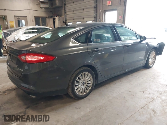 2015 Ford Fusion S Hybrid with VIN 3FA6P0UU8FR178675, listed as a IAAI auction lot 42104712 with 129,998 mi miles. Bid and sale history available at carsss.com. Image 4.