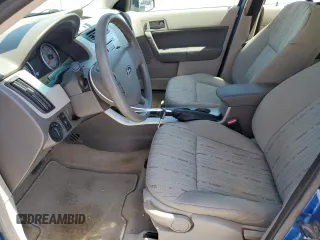 2010 Ford Focus SE with VIN 1FAHP3FN5AW259266, listed as a Copart auction lot 54657775 with 96,916 mi miles and Salvage Title. Bid and sale history available at DreamBid. Image 7.