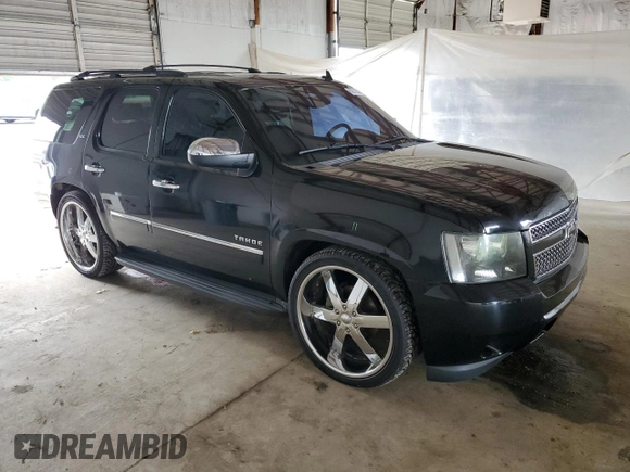 2010 Chevrolet Tahoe LTZ with VIN 1GNUKCE05AR236038, listed as a Copart auction lot 63033425 with 132,236 mi miles and Salvage title. Bid and sale history available at DreamBid. Image 4.